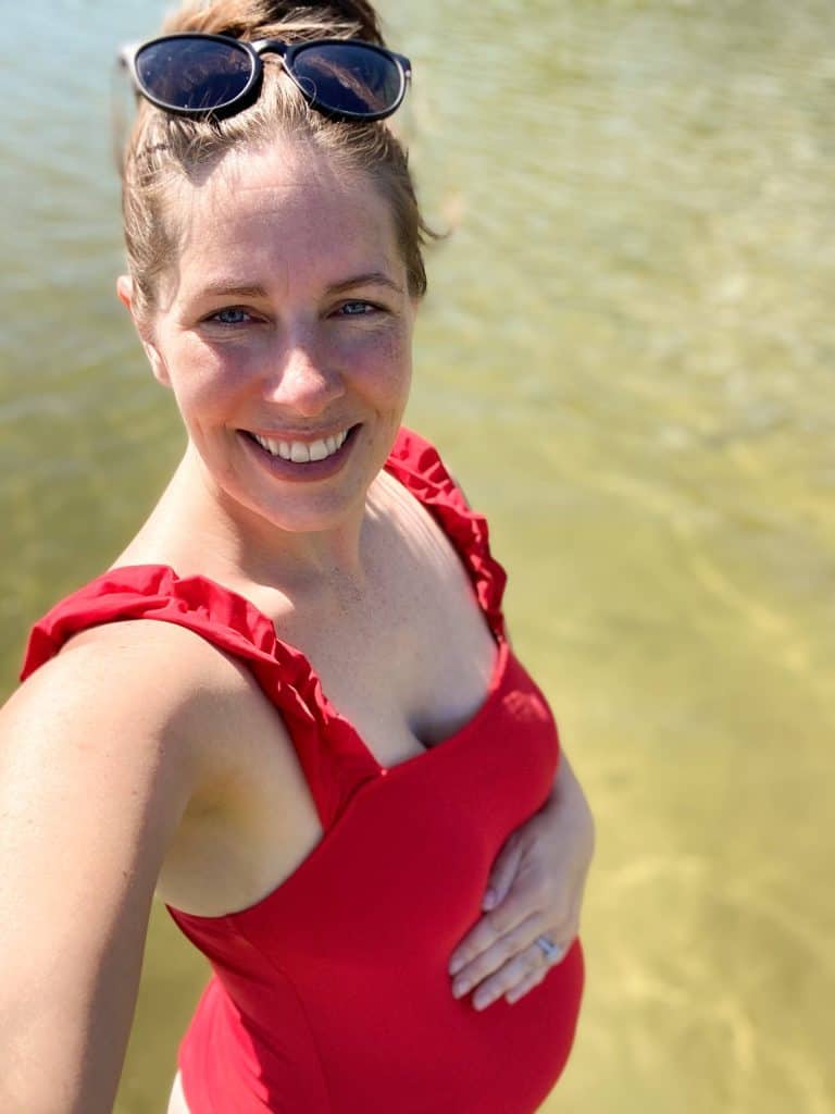 woman in maternity swimsuit in the water