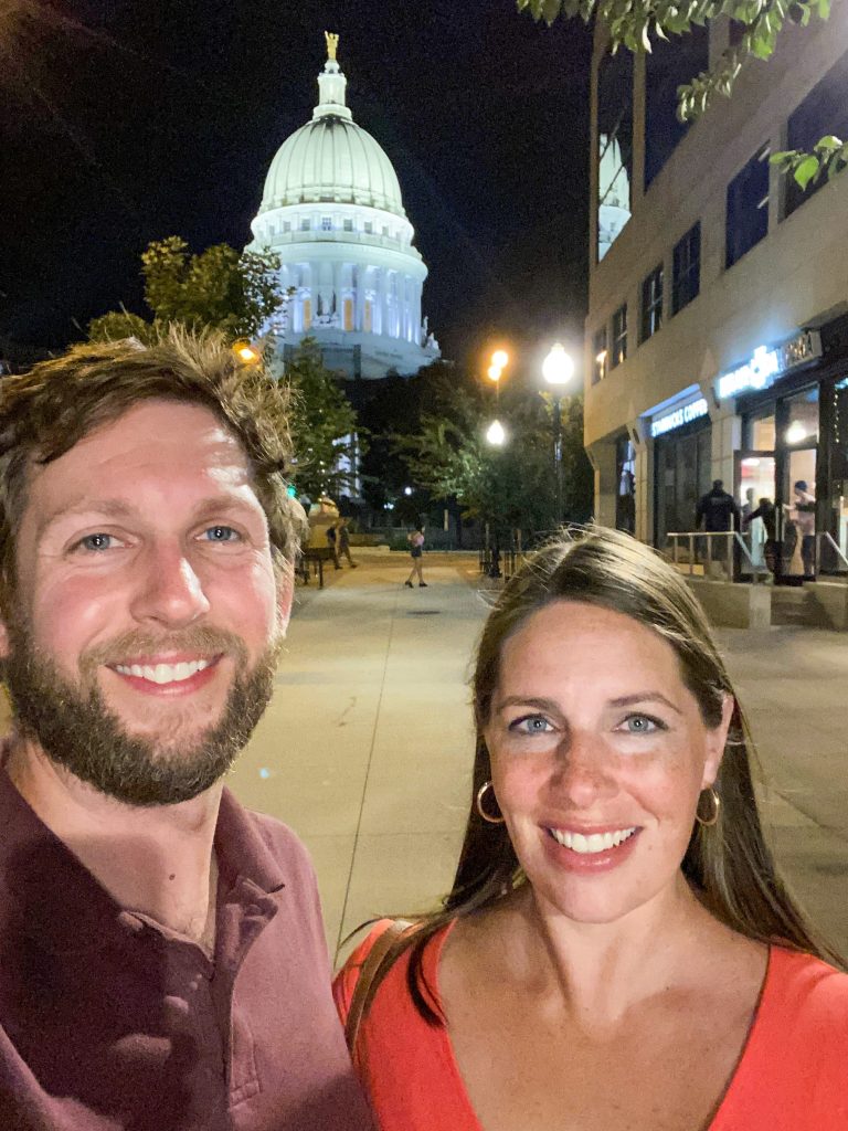 couple with Madison capitol building in the background