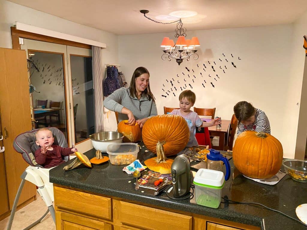 family carving pumpkins