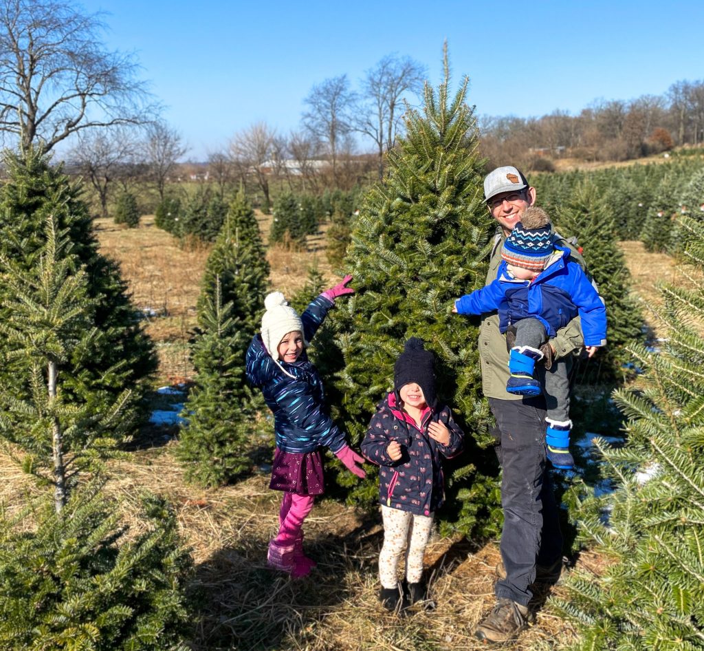 family at Christmas tree farm