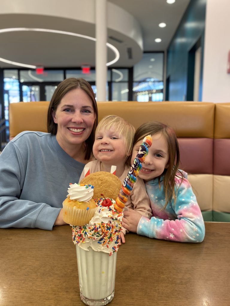 author and her two of her children with a fun ice cream shake at Soda Fountain