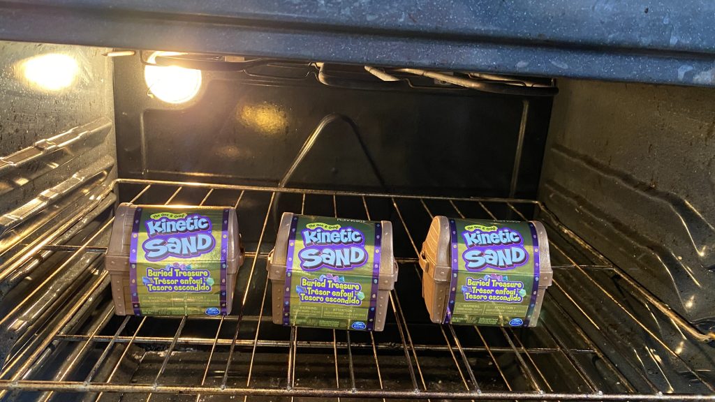 Three kinetic sand treasure chests in an oven