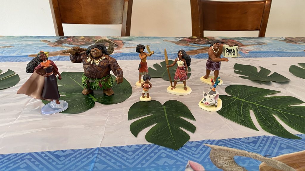 Moana figurines on table