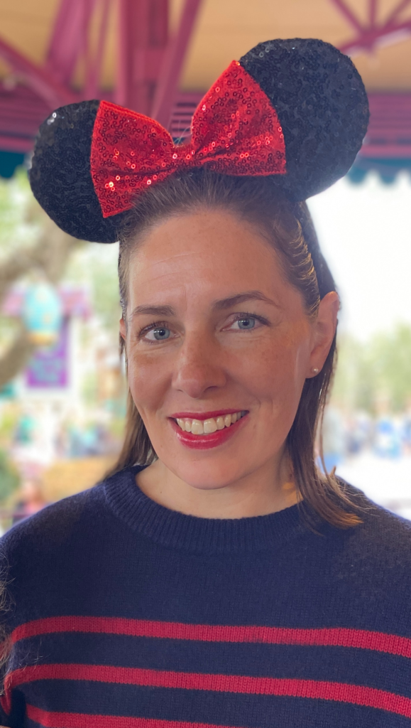 author wearing mouse ears