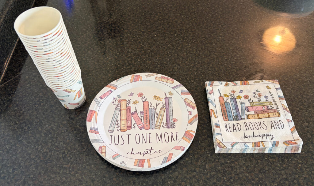 book-themed plates, cups, and napkins